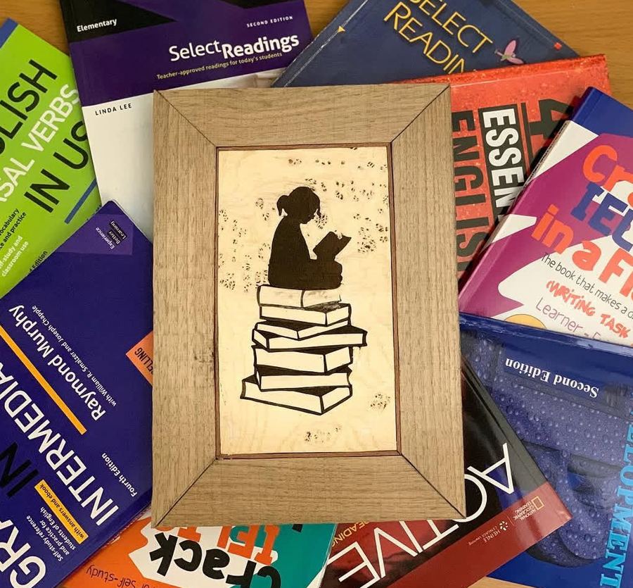 Girl on a Stack of Books