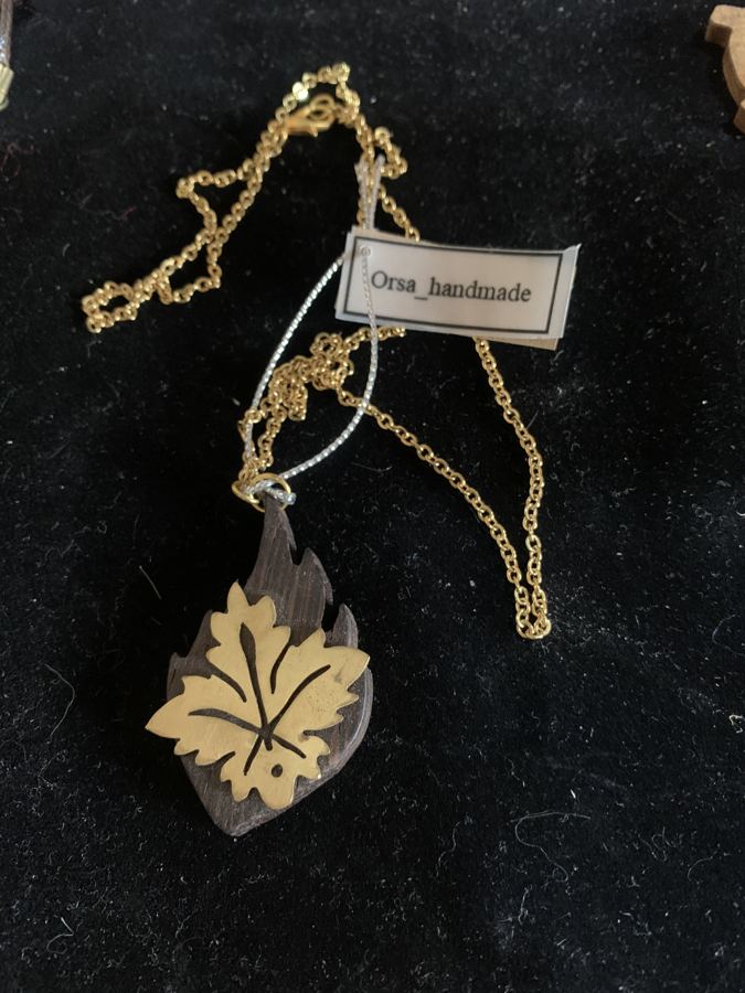 Maple Leaf on Dark Wood